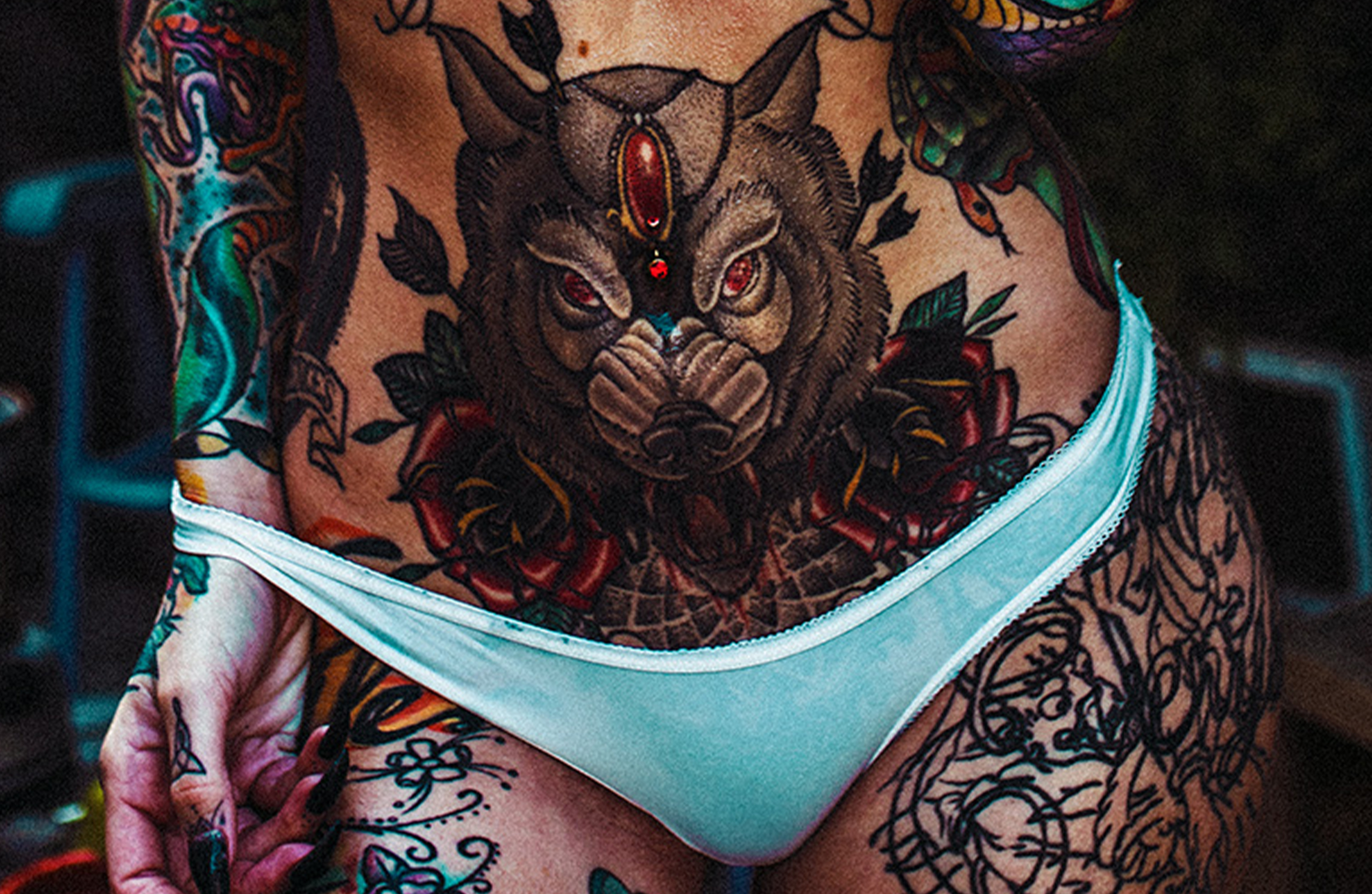 Name of tattooed woman on bad wolves nation album cover